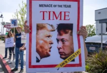 Protesters holding signs.