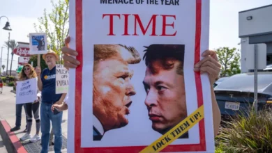Protesters holding signs.