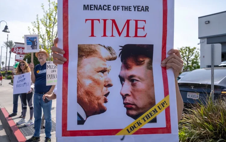 Protesters holding signs.