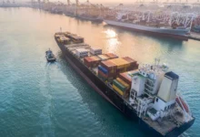 Commercial vessel carrying shipping container.