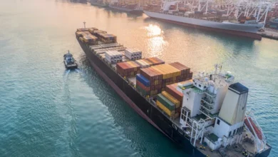 Commercial vessel carrying shipping container.