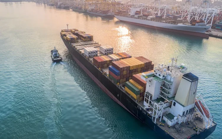 Commercial vessel carrying shipping container.